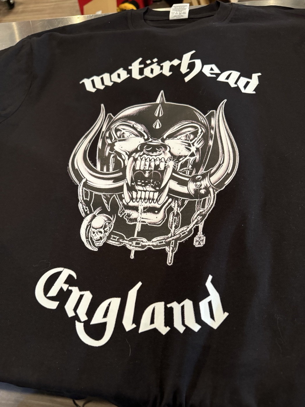 Detailed white print on black custom t-shirt made at The RAD Studio